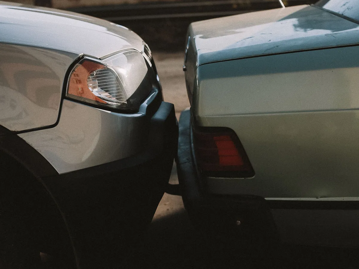 Close-up of a minor rear-end car accident on a road