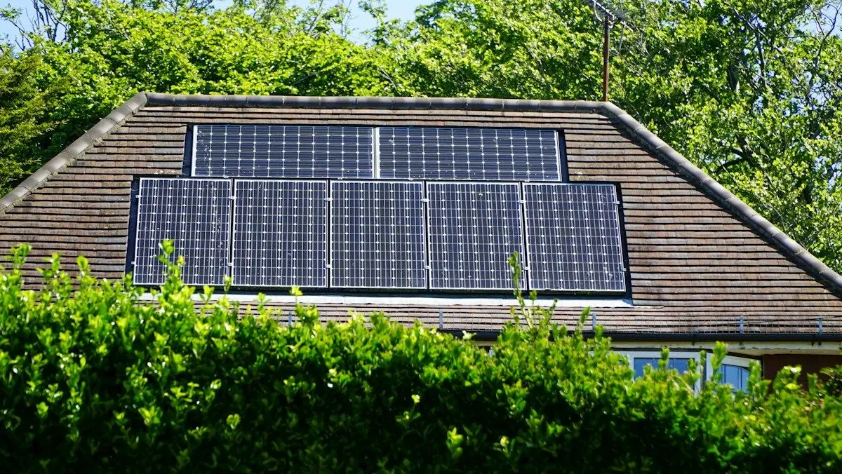Solar panels installed on the roof of a suburban house