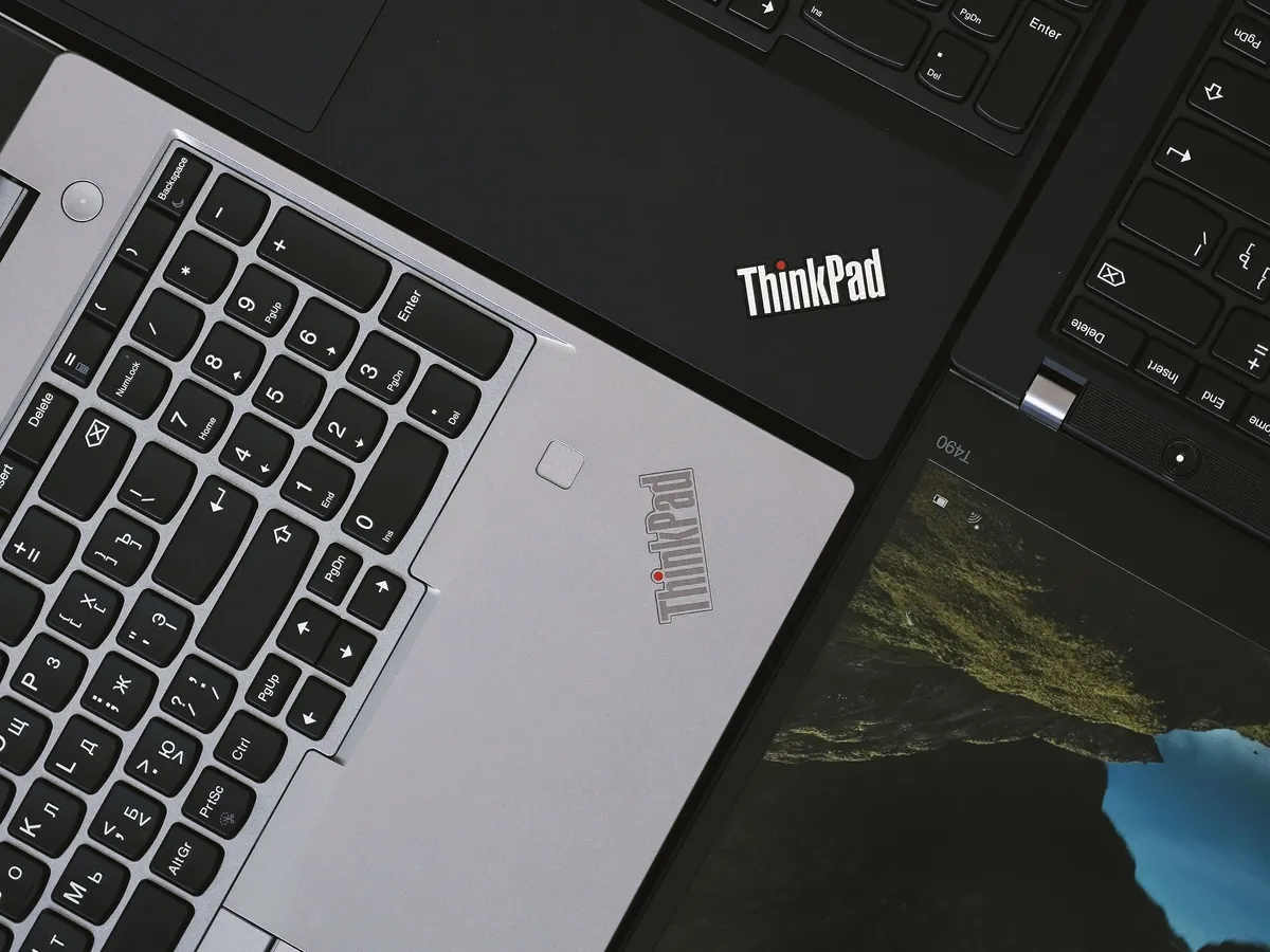Overhead view of Lenovo ThinkPad laptops with their keyboards visible
